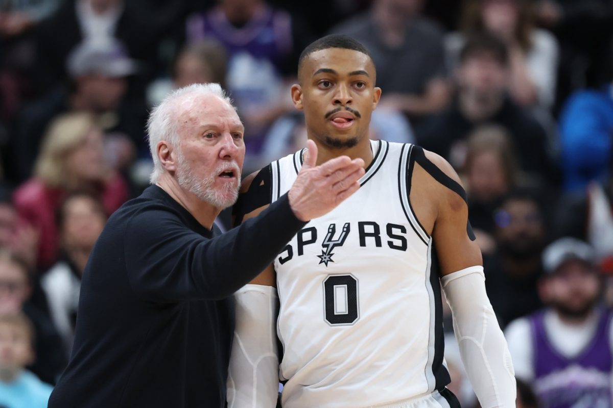 Keldon Johnson and Gregg Popovich